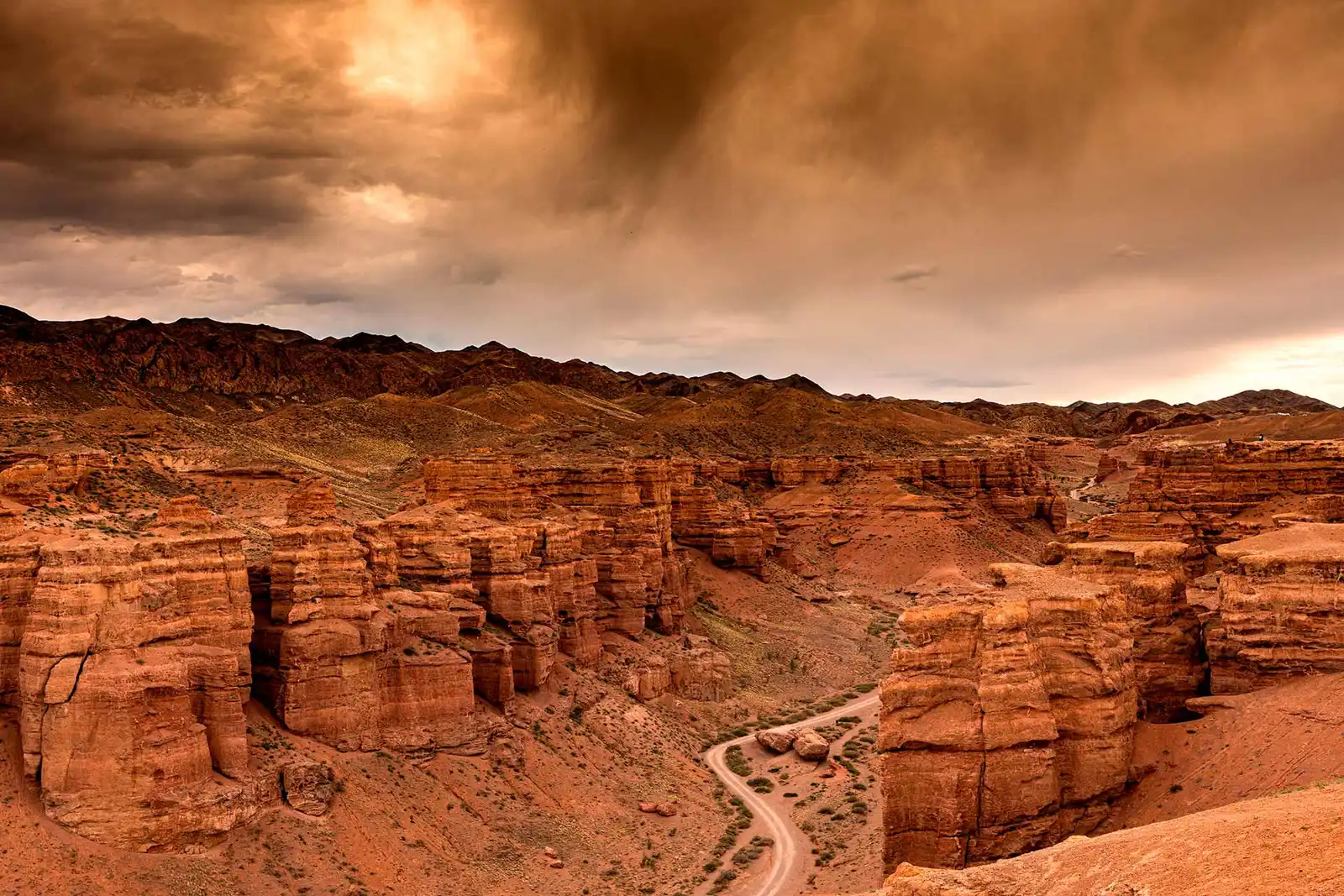 Charyn Canyon landscape at sunset: Dramatic lighting on the cliffs